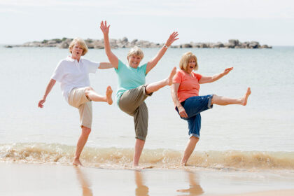 group of three senior mature retired women on their 60s having f
