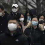 china-beijing-outbreak-facemasks-2023-01-11.jpg