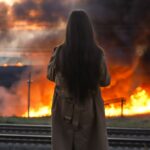 Woman,Watching,The,Wild,Fire,Burning,,Back,View