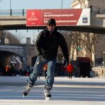 FILE PHOTO: A man skates on the Rideau Canal Skateway, the world's largest skating rink, during a period of subzero Arctic weather in Ottawa