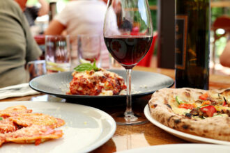 Glass,Of,Red,Wine,With,Lasagne,,Pizza,And,Ravioli
