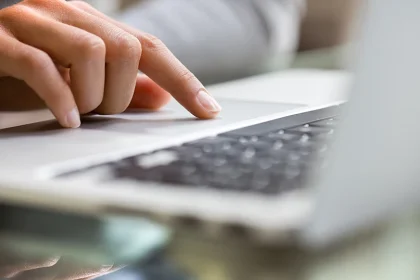 Hand Tuoching Apple Computer